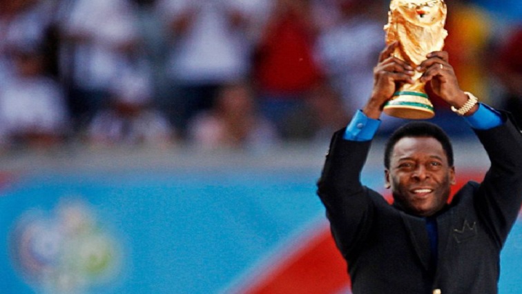 Brazilian soccer legend and member of the 1958, 1962 and 1970 World Cup-winning Brazilian soccer teams Pele holds the World Cup trophy during the World Cup 2006 opening ceremony in Munich, Germany, June 9, 2006.