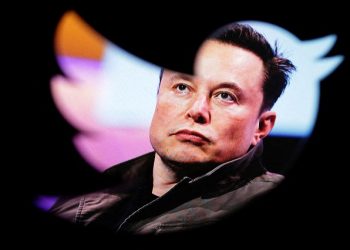 FILE PHOTO: Elon Musk's photo is seen through a Twitter logo in this illustration taken October 28, 2022. REUTERS/Dado Ruvic/Illustration