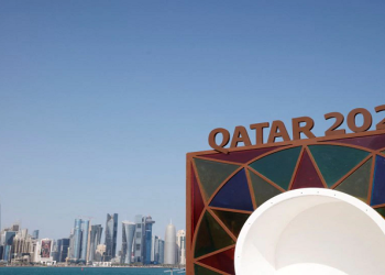 Soccer Football - 2022 World Cup Preview - Doha, Qatar - November 10, 2022 A Qatar 2022 logo is seen in front of the skyline of the West Bay in Doha REUTERS/John Sibley/File Photo