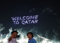 General view as people take a selfie during the fireworks display at the corniche, FIFA World Cup Qatar 2022 - Doha, Qatar.