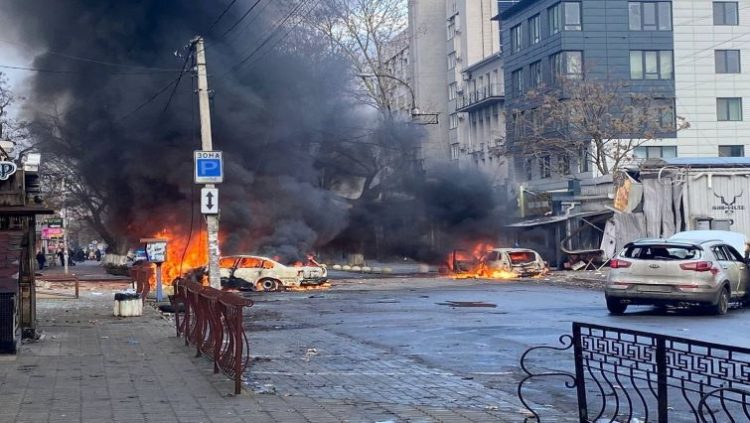 Cars burn on a street after a Russian military strike, amid Russia's attack of Ukraine, in Kherson, Ukraine December 24, 2022.