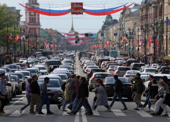Pedestrians walk across Nevsky Avenue in central Saint Petersburg, Russia May 28, 2022