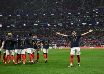 France's Theo Hernandez celebrates scoring their first goal with teammates during a match with Morocco at the 2022 FIFA World Cup in Qatar, on Wednesday, 14 December.