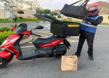 A food delivery service driver