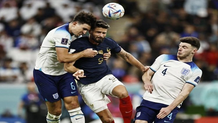 England's Harry Maguire in action with France's Olivier Giroud.