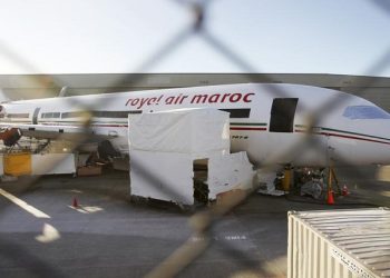 A Royal Air Maroc livery, sits idle on the tarmac parking.
