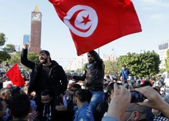 Thousands marched from Bab Souika Square in the capital towards Kasbah, waving Tunisian flags.