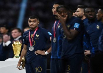 Soccer Football - FIFA World Cup Qatar 2022 - Final - Argentina v France - Lusail Stadium, Lusail, Qatar - December 18, 2022   France's Kylian Mbappe reacts after receiving the runners up medal and the Golden Boot award REUTERS/Dylan Martinez     TPX IMAGES OF THE DAY