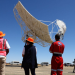 People look at South Africa's prototype dish of the Square Kilometre Array-Mid telescope outside the town of Carnarvon, with a similar ceremony taking place in SKA co-host Australia on the same day, South Africa, December 5, 2022.