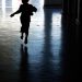 [File Image]A child running away from the dark room.