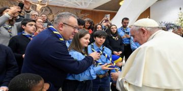 Pope Francis meets people and children as he attends the weekly general audience at the Vatican, December 21, 2022.