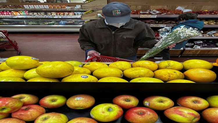 A person shops at a  grocery store in the Manhattan borough of New York City, New York, U.S., March 10, 2022.