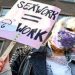 A protester holds a placard as Dutch sex workers demonstrate to demand the right to go back to work, amid the coronavirus disease (COVID-19) pandemic, in The Hague, Netherlands March 2, 2021.
