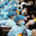 Medical workers inoculate students with the vaccine against the coronavirus disease (COVID-19) at a university in Qingdao, Shandong province, China March 30, 2021.