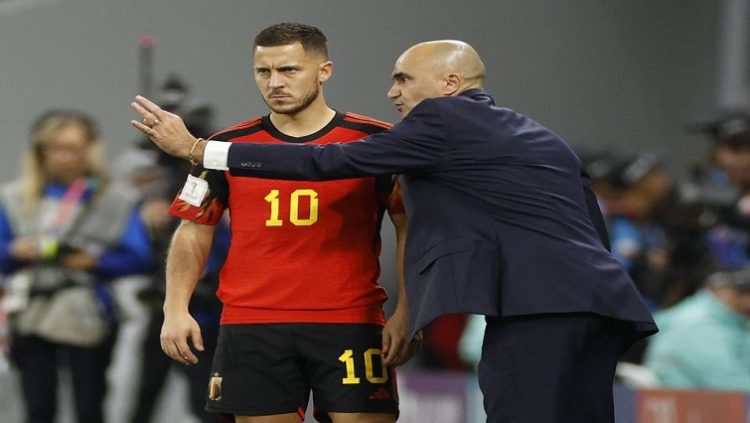 Belgium coach Roberto Martinez gives instructions to Eden Hazard before he comes on as a substitute