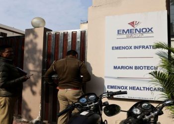 Police is seen at the gate of an office of Marion Biotech, a healthcare and pharmaceutical company and a part of the Emenox Group, whose cough syrup has been linked to the deaths of children in Uzbekistan, in Noida, India, December 29, 2022.