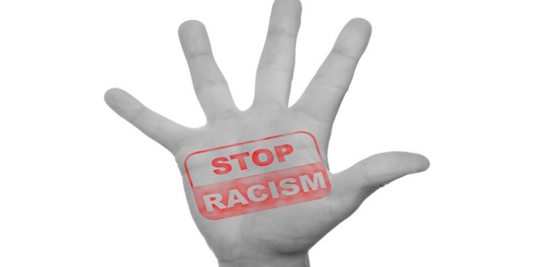 Graphic of a hand opposing racism.