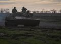 Ukrainian servicemen ride a self-propelled howitzer, amid Russia's attack on Ukraine, on a frontline in Donetsk region, Ukraine November 30, 2022.  Radio Free Europe/Radio Liberty/Serhii Nuzhnenko via REUTERS