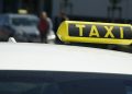 Taxi sign seen on top of a vehicle