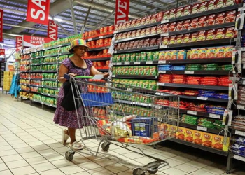 [file photo]A woman shops in store at Maponya mall in Soweto, South Africa, October 20, 2022. REUTERS/Siphiwe Sibeko