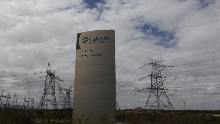 Pylons carry electricity from a sub-station of state power utility Eskom outside Cape Town