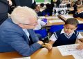 Western Cape Premier Alan Winde is pictured interacting with a pupil at the Starling Primary School in Cape Town on 18 January 2023.