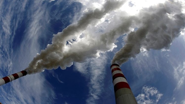 FILE PHOTO: Smoke billows from the chimneys of Belchatow Power Station in Poland, Europe's biggest coal-fired power plant, in this May 7, 2009.