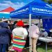 Officials of the Ditsobotla Local Municipality are seen assisting community members with applications for the registration of free basic services.