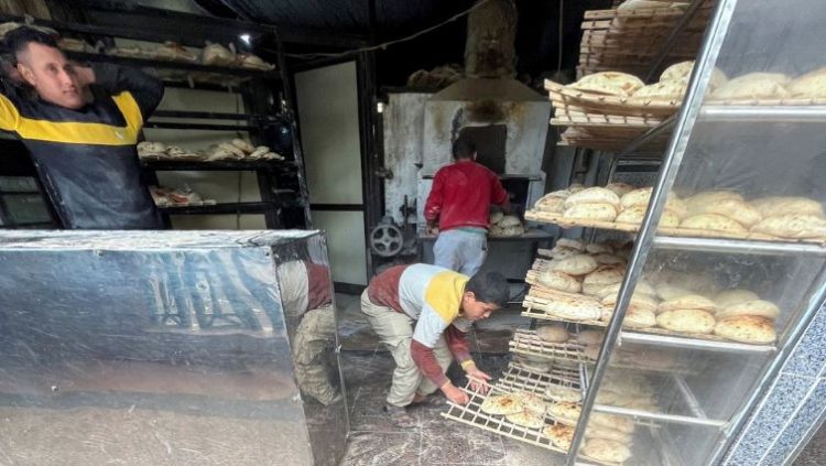 Employees arrange bread for sale at a bakery in Maadi, a suburb of Cairo, Egypt, January 31, 2022.