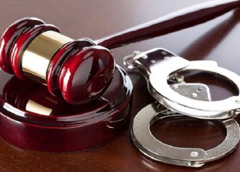 [File Image]: Court gavel and handcuffs