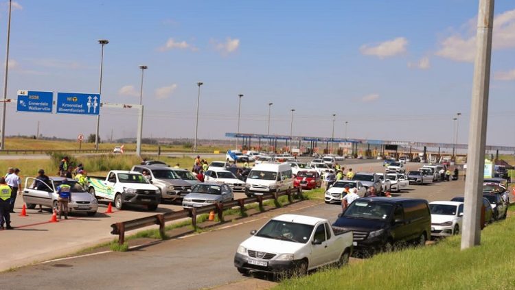 Traffic police conduct a road black at the N1 Grasmere Toll Plaza in Lenasia.