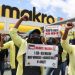 Workers disgruntled over low wages and changes to terms and conditions of employment, go on strike outside a Massmart Holdings owned Makro store in Johannesburg, South Africa, November 19, 2021.