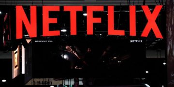 Signage at the Netflix booth is seen on the convention floor at Comic-Con International in San Diego, California, US, July 21, 2022.