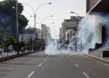 Police use tear gas during the 'Take over Lima' march to demonstrate against Peru's President Dina Boluarte, following the ousting and arrest of former President Pedro Castillo, in Lima, Peru January 19, 2023.
