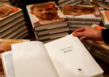 A person looks at a copy of Britain's Prince Harry's autobiography 'Spare' displayed at Waterstones bookstore, in London, Britain January 10, 2023.