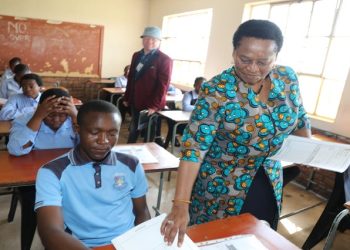 Deputy Minister for the Department of Basic Education, Dr 
Reginah Mhaule handing out exam papers at a school in Mpumalanga during the national matrica examinations on November 17, 2022.