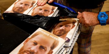 A staff member unpacks copies of Britain's Prince Harry's autobiography 'Spare' at Waterstones bookstore, in London, Britain January 10, 2023.