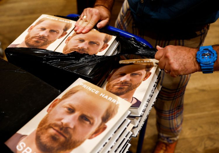 A staff member unpacks copies of Britain's Prince Harry's autobiography 'Spare' at Waterstones bookstore, in London, Britain January 10, 2023.