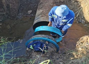FILE IMAGE: A municipal worker fixes a water pipe