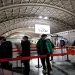 Travellers queue to board a plane at Chengdu Shuangliu International Airport amid a wave of the coronavirus disease (COVID-19) infections, in Chengdu, Sichuan province, China December 30, 2022.