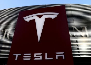 [File Image] : A logo of the electric vehicle maker Tesla is seen near a shopping complex in Beijing, China