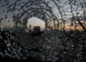 A building is seen through a bullet hole in a window of the Africa Hotel in the town of Shire, Tigray region, Ethiopia, March 16, 2021.