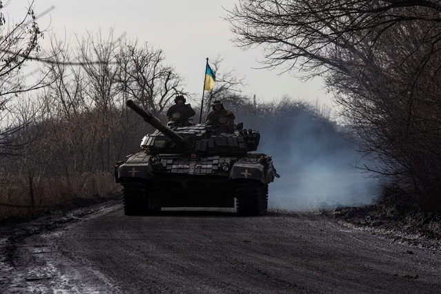 Ukrainian servicemen ride atop a tank near the frontline town of Bakhmut, amid Russia's attack on Ukraine, in Donetsk region, Ukraine January 20, 2023