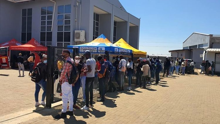 Learners line up outside a Technical and Vocational Education and Training (TVET).
