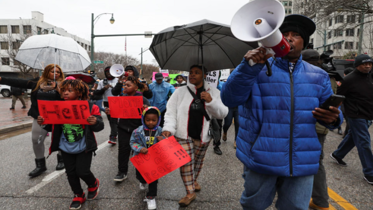 Nakia, Daniel 5, Darius 11 and Devonte 8 take part in a protest after the release of the body cam footage showing police officers beating Tyre Nichols, who then died three days later after he was pulled over while driving during a traffic stop by Memphis police officers, in downtown Memphis, Tennessee, US, January 28, 2023.