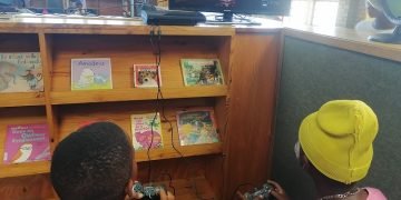Children play video games at the library on the Cape Flats
