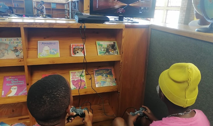 Children play video games at the library on the Cape Flats