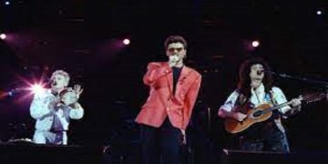 Singer George Michael (C) performs with Queen at the Freddie Mercury Tribute Concert for AIDS Awareness, at Wembley Stadium, in London Britain April 20, 1992.