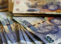 File image: South African Rands consisting of R100 notes.