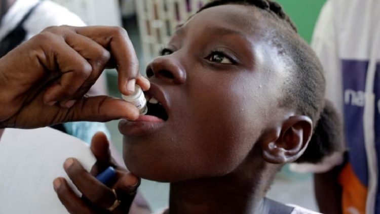 A girl receives an oral cholera vaccine, November 8, 2016.